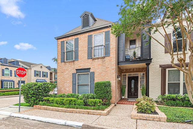 3749 Wakeforest St, Houston, TX 77098 - view of front of home with a balcony, brick siding, and a residential view