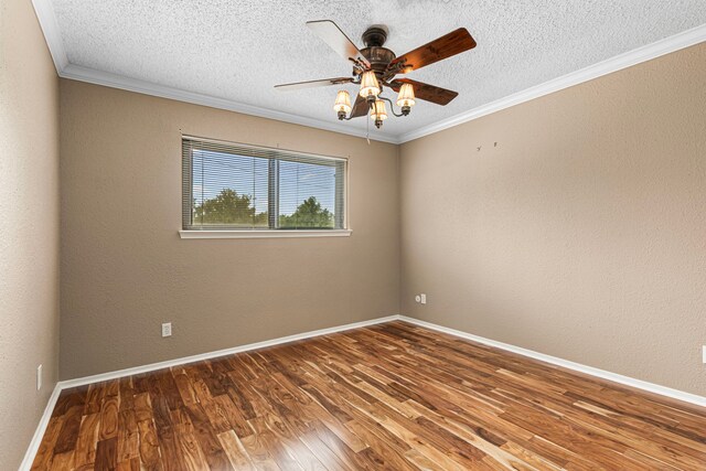 3749 Wakeforest St, Houston, TX 77098 - empty room with ceiling fan, wood finished floors, a textured ceiling, crown molding, and baseboards