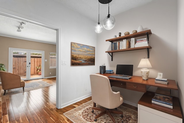 3749 Wakeforest St, Houston, TX 77098 - office area featuring wood finished floors, baseboards, a textured ceiling, and french doors