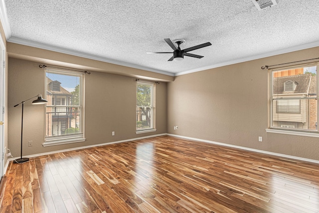 3749 Wakeforest St, Houston, TX 77098 - spare room featuring ornamental molding, a textured ceiling, wood finished floors, baseboards, and ceiling fan