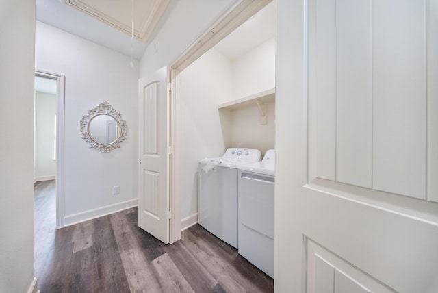 laundry area featuring laundry area, attic access, washing machine and clothes dryer, baseboards, and dark wood-type flooring