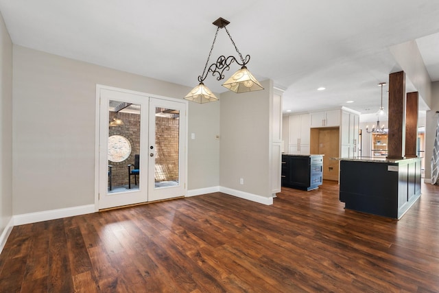 interior space with an inviting chandelier, french doors, recessed lighting, baseboards, and dark wood-style floors