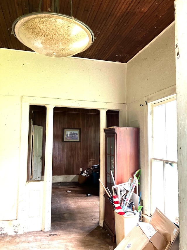 hallway featuring wood ceiling and hardwood / wood-style flooring