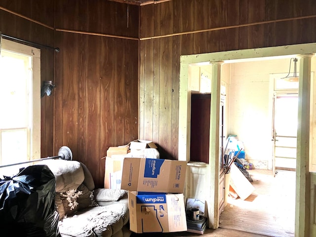 miscellaneous room featuring wooden walls and wood finished floors