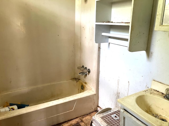 full bath with vanity and a bath