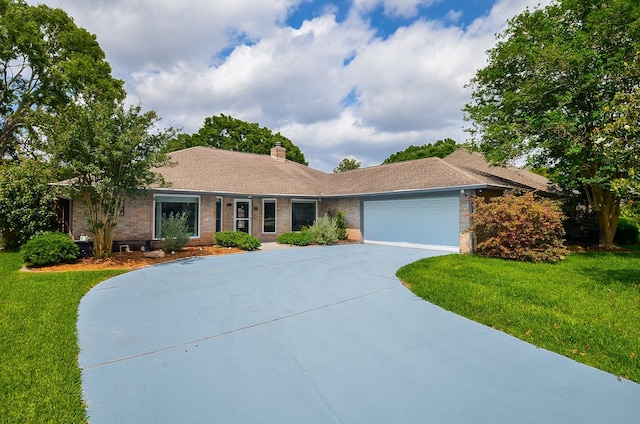 ranch-style house featuring a garage, a front yard, driveway, brick siding, and a chimney