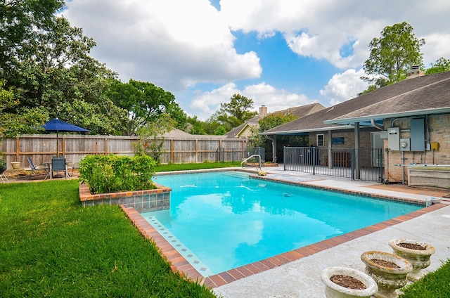 view of swimming pool featuring a patio area
