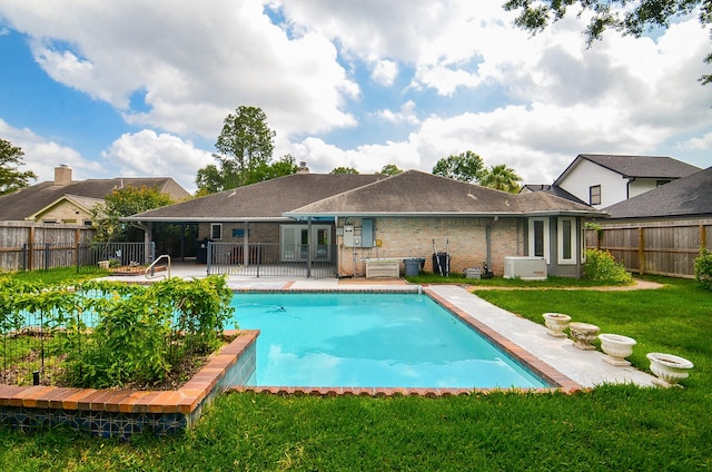 rear view of property featuring a patio area and brick siding