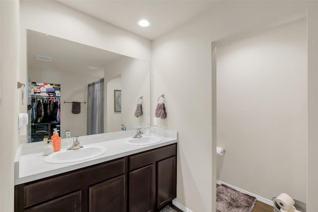 2415 Allendale Garden Ln, Spring, TX 77373 - bathroom with double vanity and a walk in closet