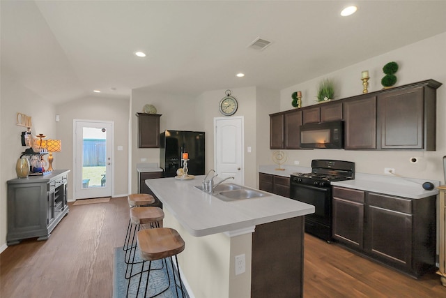 2415 Allendale Garden Ln, Spring, TX 77373 - kitchen with black appliances, a sink, dark wood-style floors, dark brown cabinetry, and light countertops