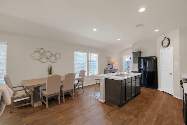 2415 Allendale Garden Ln, Spring, TX 77373 - kitchen featuring black appliances, dark wood-style floors, a sink, light countertops, and recessed lighting