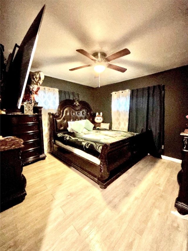8038 Woodlyn Rd, Houston, TX 77028 - bedroom with a textured ceiling, ceiling fan, and wood finished floors