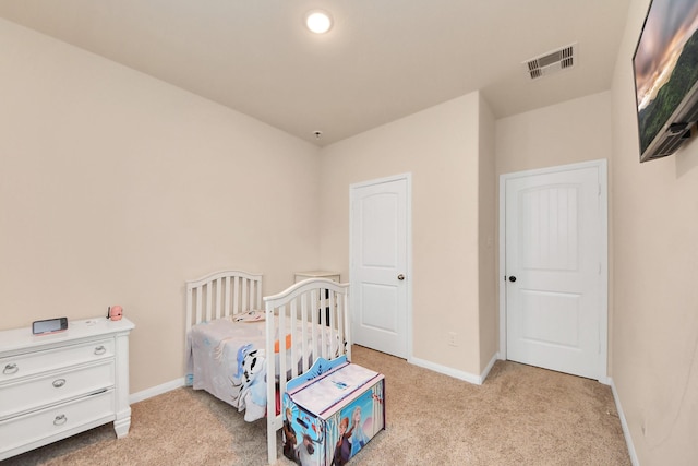 bedroom with carpet flooring, baseboards, and visible vents