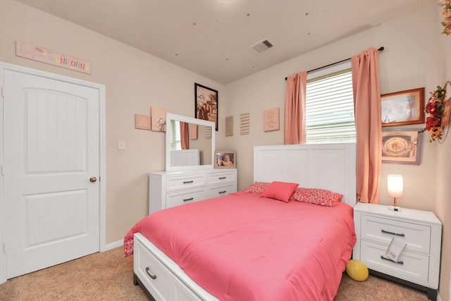 217 Kickapoo Dr, Anahuac, TX 77514 - bedroom featuring light carpet and visible vents