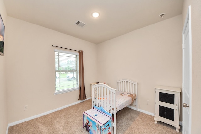 bedroom featuring carpet flooring, baseboards, and visible vents