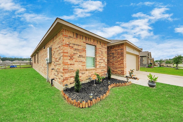 view of home's exterior with a lawn, an attached garage, concrete driveway, and brick siding