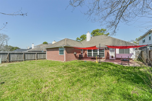 20319 Concord Hill Dr, Cypress, TX 77433 - rear view of house with brick siding, a fenced backyard, a patio area, and a yard