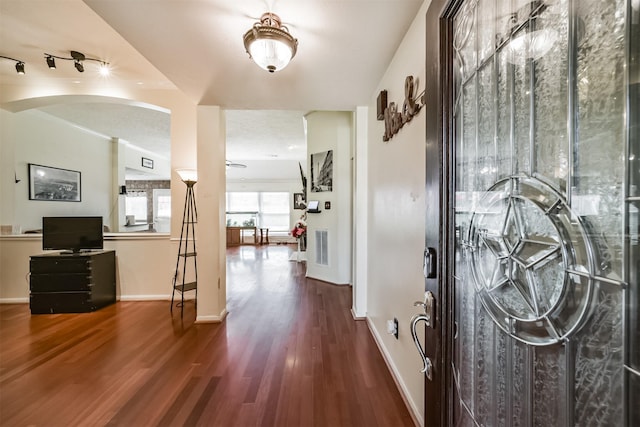 20319 Concord Hill Dr, Cypress, TX 77433 - entrance foyer with baseboards, arched walkways, and wood finished floors