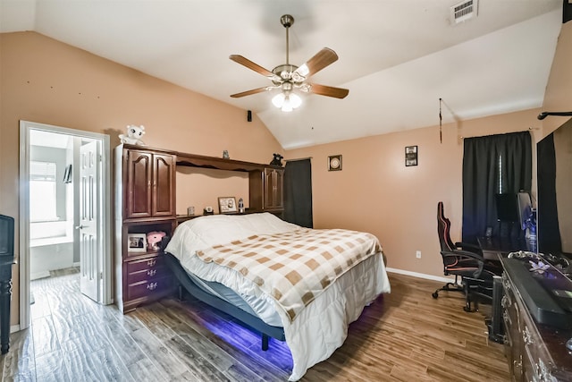 20319 Concord Hill Dr, Cypress, TX 77433 - bedroom featuring visible vents, wood finished floors, baseboards, lofted ceiling, and ensuite bath