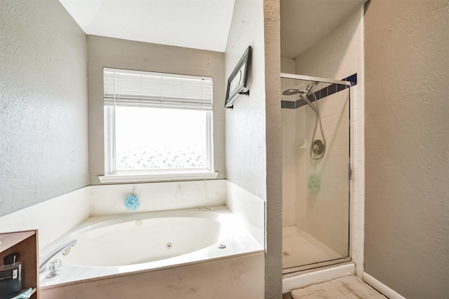 20319 Concord Hill Dr, Cypress, TX 77433 - full bath with a bath, a textured wall, and a stall shower
