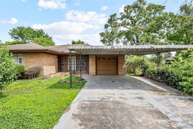 view of front of home featuring an attached garage, driveway, a front lawn, and brick siding
