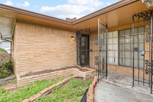 property entrance with brick siding