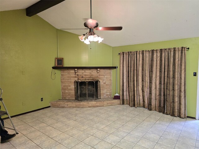 unfurnished living room with ceiling fan, a fireplace, and tile patterned flooring