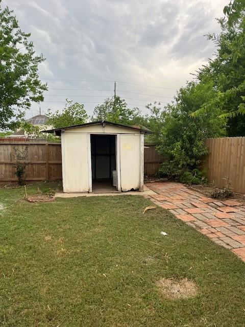 view of shed featuring a fenced backyard