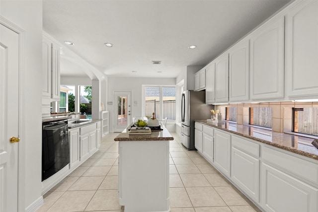 5514 Chase Hbr, Houston, TX 77041 - kitchen with dishwashing machine, a center island, healthy amount of natural light, freestanding refrigerator, and recessed lighting