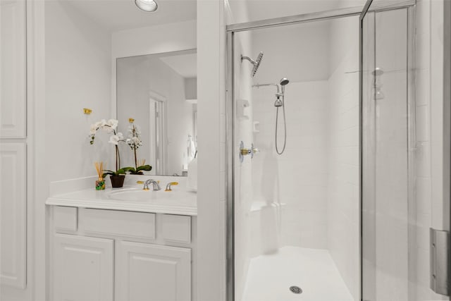 bathroom with vanity and a shower stall