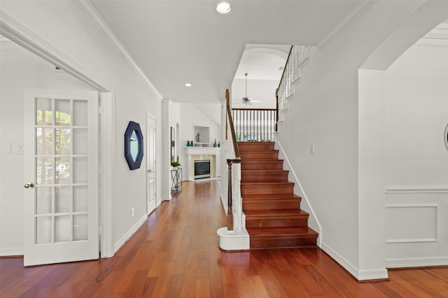 5514 Chase Hbr, Houston, TX 77041 - foyer featuring ceiling fan, a glass covered fireplace, hardwood / wood-style floors, stairway, and recessed lighting