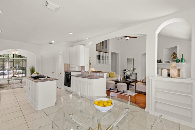 5514 Chase Hbr, Houston, TX 77041 - kitchen with a ceiling fan, arched walkways, light tile patterned flooring, and recessed lighting