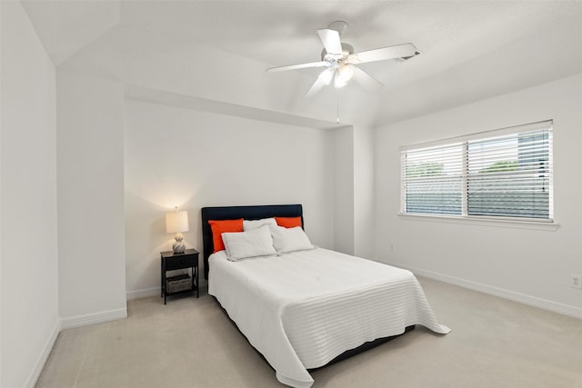 carpeted bedroom featuring ceiling fan and baseboards