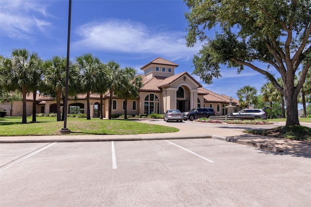 view of property featuring uncovered parking