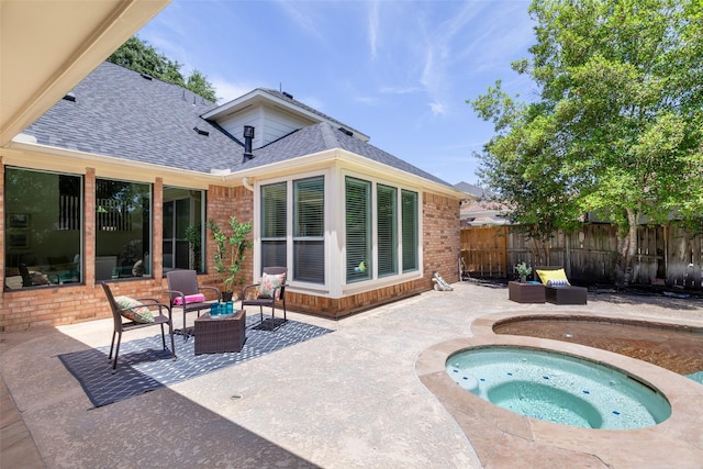 5514 Chase Hbr, Houston, TX 77041 - rear view of property featuring a shingled roof, a patio area, an in-ground hot tub, and brick siding