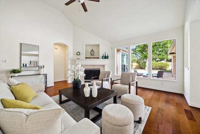 5514 Chase Hbr, Houston, TX 77041 - living room featuring arched walkways, ceiling fan, a glass covered fireplace, wood finished floors, and high vaulted ceiling