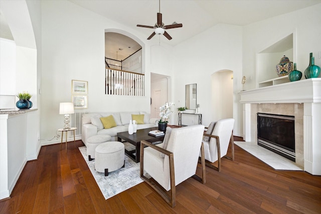 5514 Chase Hbr, Houston, TX 77041 - living room with ceiling fan, hardwood / wood-style floors, arched walkways, a tile fireplace, and high vaulted ceiling