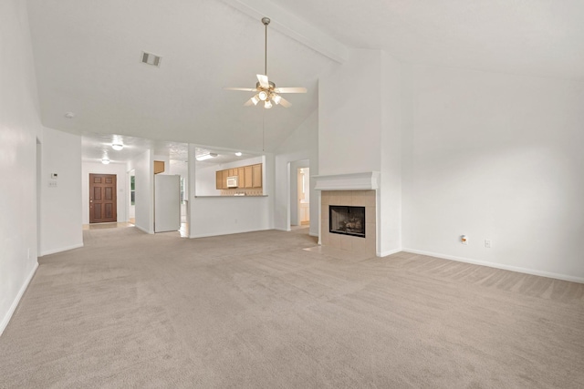 2418 Fawnlake Cir, Katy, TX 77493 - unfurnished living room featuring high vaulted ceiling, a ceiling fan, light colored carpet, and visible vents
