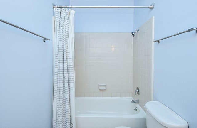 full bathroom with toilet and shower / bathtub combination with curtain