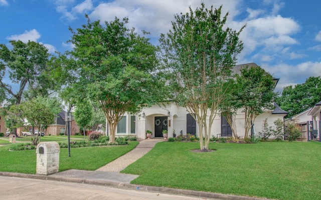 734 Windbreak Trl, Houston, TX 77079 - obstructed view of property featuring a front lawn and brick siding