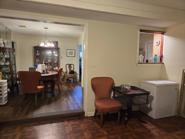 dining space with visible vents and a chandelier