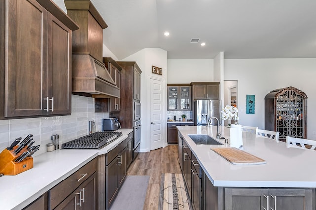 41015 Kimber Ln, Magnolia, TX 77354 - kitchen featuring light countertops, appliances with stainless steel finishes, a sink, and visible vents