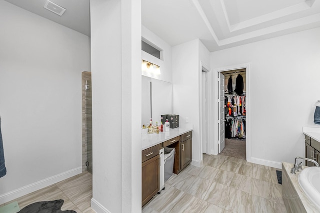 41015 Kimber Ln, Magnolia, TX 77354 - full bathroom featuring a tub, visible vents, a stall shower, vanity, and a spacious closet