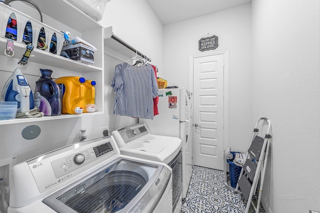 41015 Kimber Ln, Magnolia, TX 77354 - laundry area featuring laundry area, washer and clothes dryer, and light tile patterned flooring