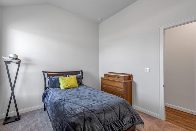 41015 Kimber Ln, Magnolia, TX 77354 - bedroom featuring baseboards, vaulted ceiling, and carpet