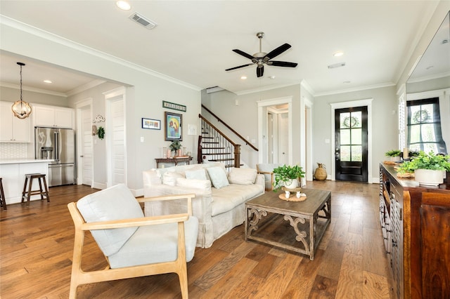 12 Caravelle Ct, Galveston, TX 77554 - living area featuring recessed lighting, stairway, a ceiling fan, wood finished floors, and ornamental molding