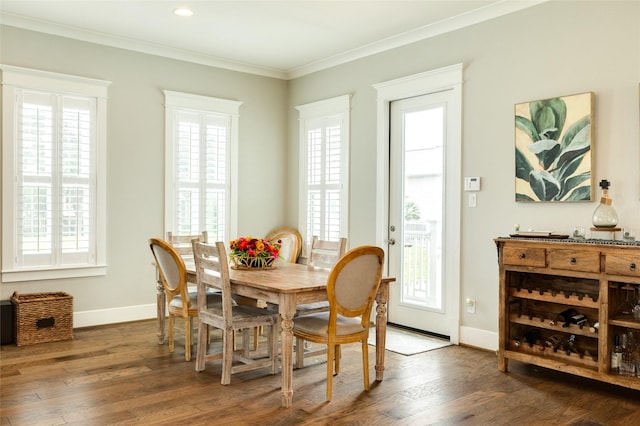 12 Caravelle Ct, Galveston, TX 77554 - dining area featuring healthy amount of natural light, wood finished floors, crown molding, and baseboards