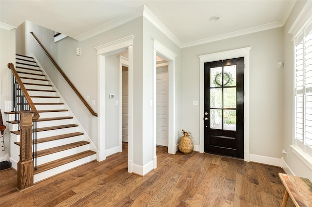 12 Caravelle Ct, Galveston, TX 77554 - foyer entrance with stairway, wood finished floors, baseboards, and ornamental molding
