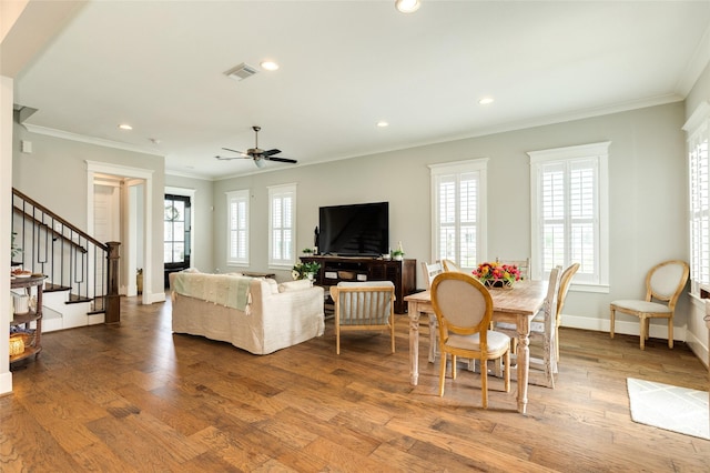 12 Caravelle Ct, Galveston, TX 77554 - living area with stairway, healthy amount of natural light, crown molding, ceiling fan, and recessed lighting