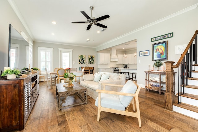 12 Caravelle Ct, Galveston, TX 77554 - living area featuring a ceiling fan, wood finished floors, stairway, ornamental molding, and recessed lighting